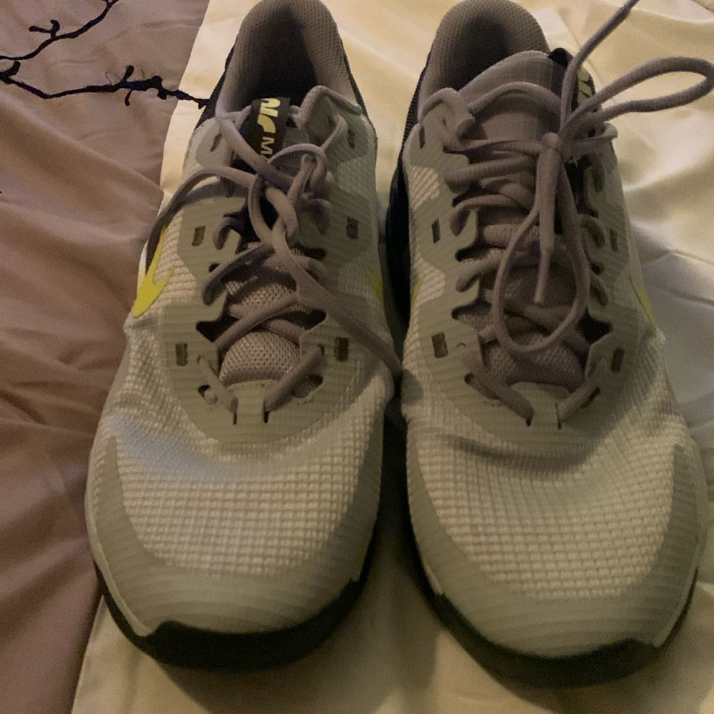 Men's 9.5 Nike tennis shoes. Too small for son. Lightly used.